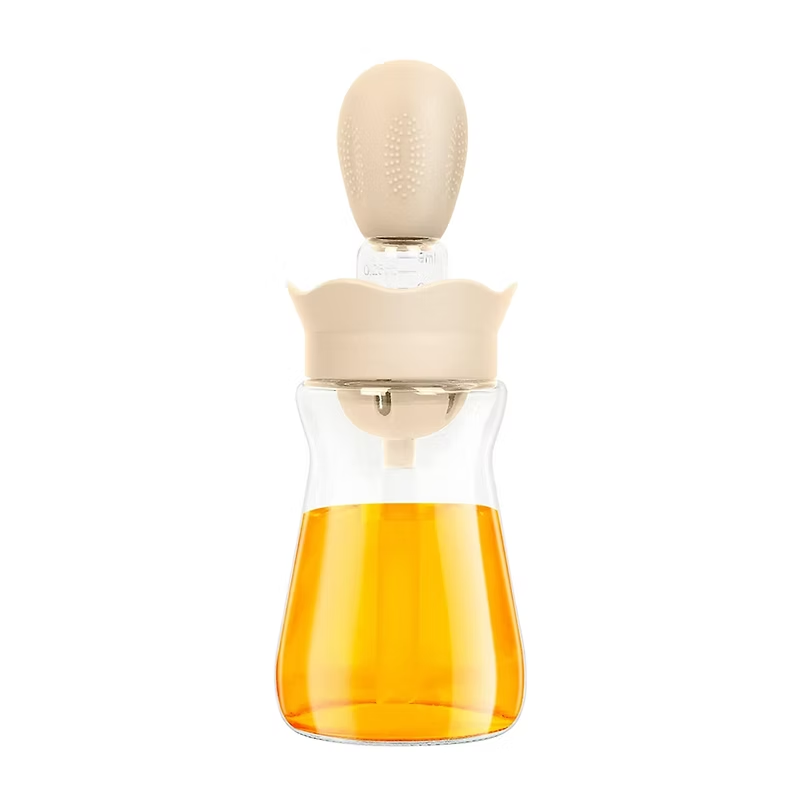 Стъклената бутилка със силиконова четка и дозатор разполага с капкомер за по-лесно регулиране на количеството мазнина. Аксесоари за кухня, кухненски принадлежности.
